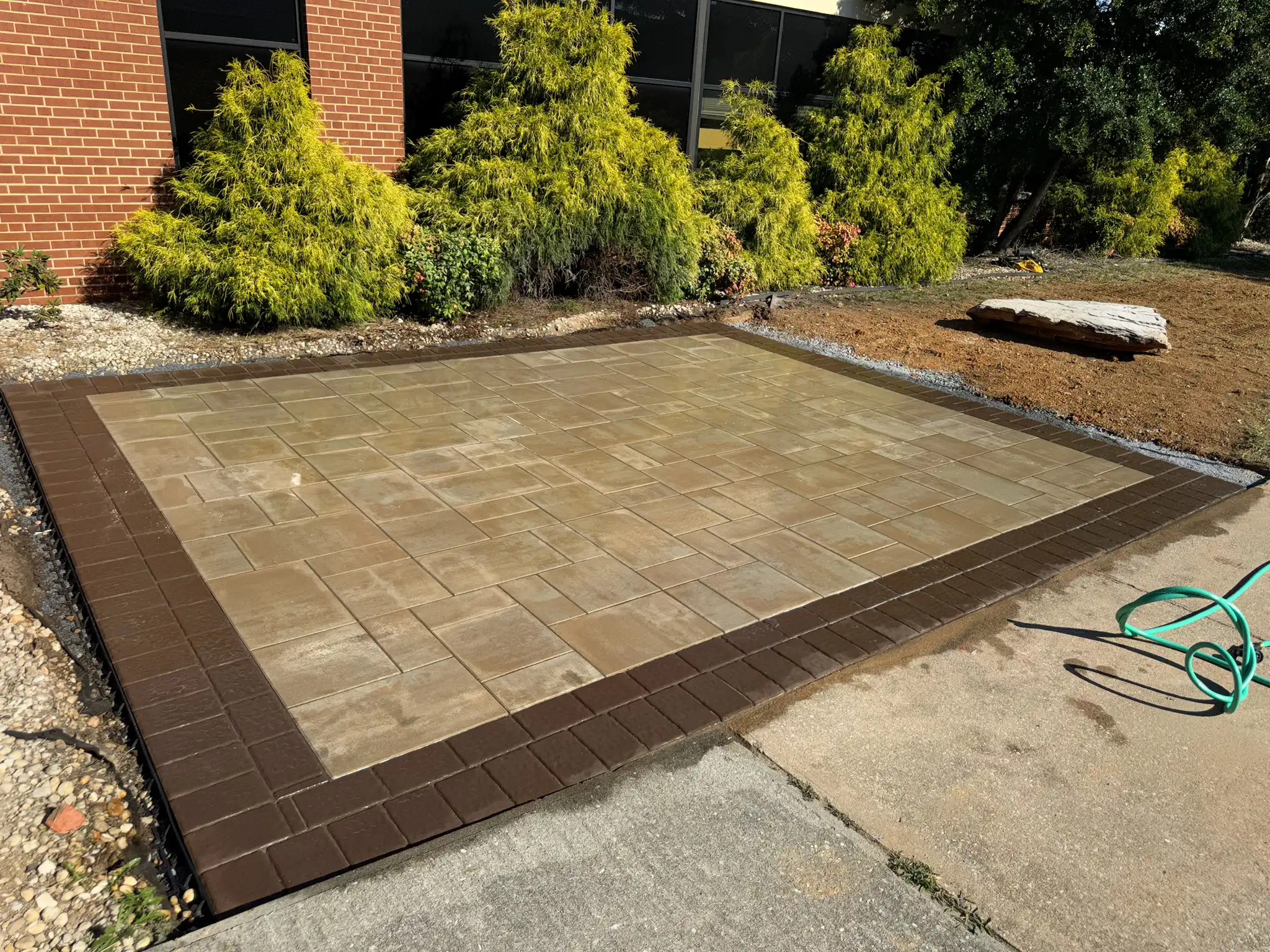 Patio with integrated fire pit and sitting wall