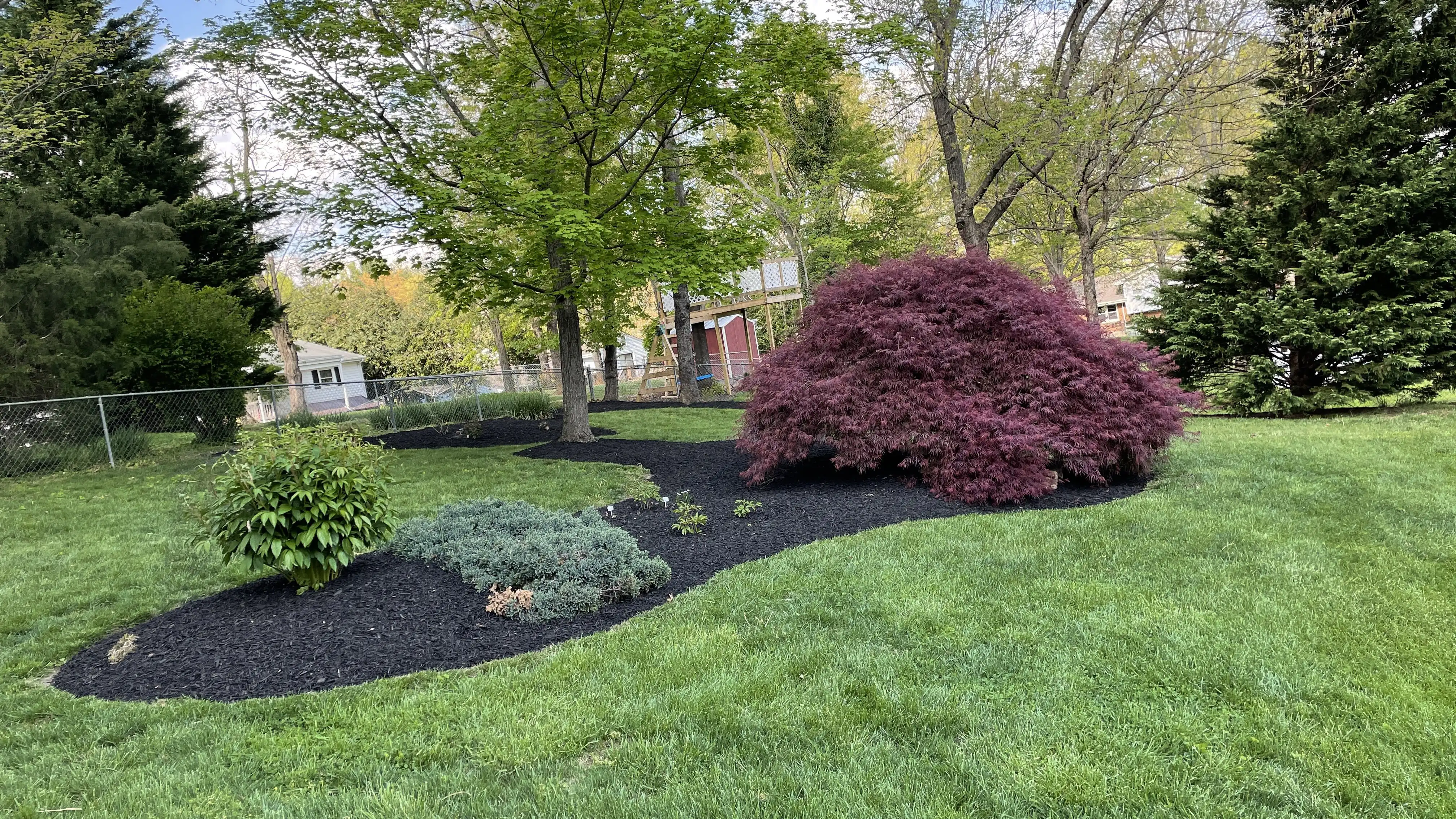 Foundation plantings with mulched beds