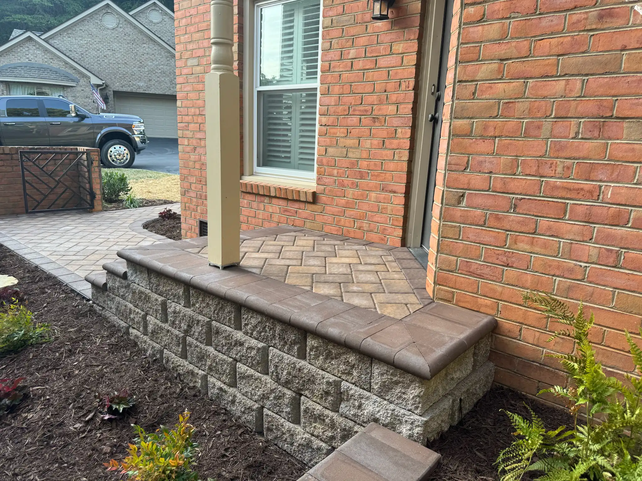 Stone steps connecting patio levels on hillside lot